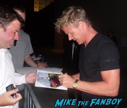Gordon Ramsay signing autographs for fans after doing a promotional appearance for hell's kitchen