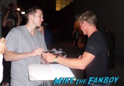 Gordon Ramsay  signing autographs for fans after doing a promotional appearance for hell's kitchen