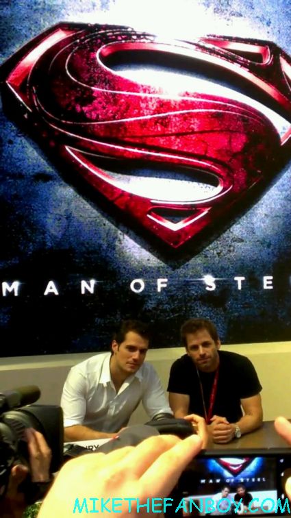 Henry Cavill hot and sexy with zach snyder  at the man of steel autograph signing at the WB booth for man of steel rare promo
