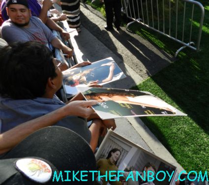 scotty holding out his 11 x 14 photo for Bella Thorne  the odd life of timothy green world movie premiere in hollywood at the el capitan theatre rare promo jennifer garner joel edgerton