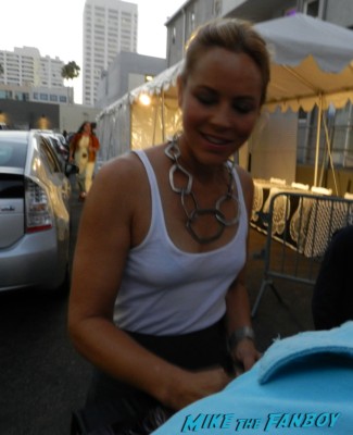Maria Bello signing autographs for fans at an emmy week party prime suspect funky hat star