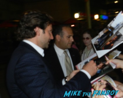 sexy hot bradley cooper signing autographs for fans at the words movie premiere with bradley cooper and zoe saldana
