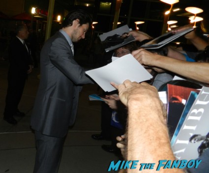 sexy ben barnes signing autographs for fans at the words movie premiere with bradley cooper and zoe saldana