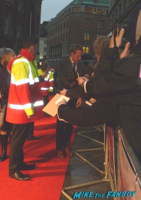 paul Bettany signing autographs for fans at the red carpet soaking up rain BFI London Film Festival rare blood movie premiere rare paul bettany signing autographs for fans rare