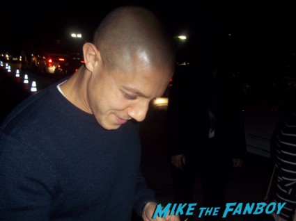 Theo Rossi from sons of anarchy signing autographs for fans at the season 5 wrap party