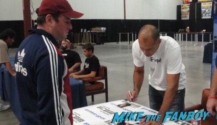Royce Gracie signing autographs for fans hot sexy ufc champ rare promo frank and sons 