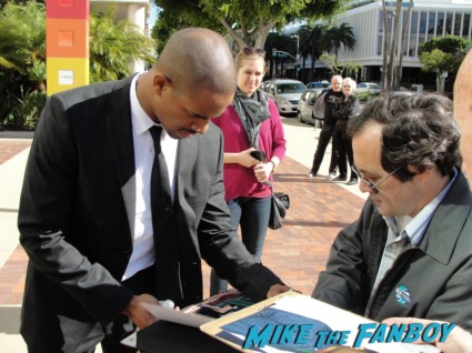 Damon Wayans Jr. signing autographs for fans at a happy endings q and a in los angeles
