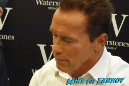 Arnold Schwarzenegger signed autograph signature total recall my life so far signing autographs at his book signing at waterstons in london the uk rare promo book signing