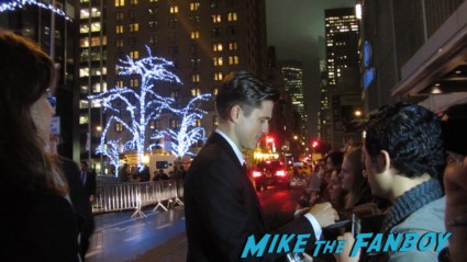 Aaron Tveit signing autographs for fans at the les miserables new york movie premiere signed autograph rare promo 
