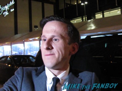Adam Brown Ori from the hobbit signing autographs for fans at the hobbit premiere in new york city