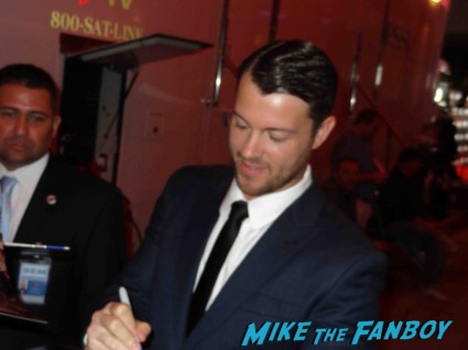 Dan Feuerriegel signing autogaphs at the Spartacus: War of the Damned television premiere starz cast rare red carpet liam mcintyre lucy lawless