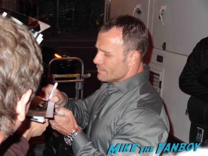 Barry Duffield signing autogaphs at the Spartacus: War of the Damned television premiere starz cast rare red carpet liam mcintyre lucy lawless