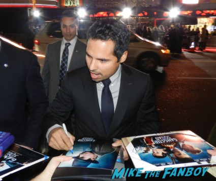 sexy Michael Peña signing autographs at the Gangster Squad Movie Premiere red carpet marquee with sean penn ryan gosling emma stone josh brolin