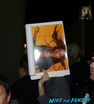 scotty holding up his vintage jennifer lopez promo poster jennifer lopez's boyfriend casper taking her dog for a walk and a shit while she tapes a talk show
