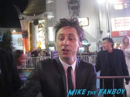 zach braff signing autographs for fans Oz the great and powerful movie premiere red carpet with james franco mila kunis michelle williams