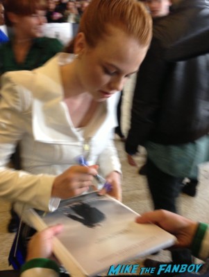 Annie Thurman signing autographs for fans the dark skies movie premiere at the arclight cinerama dome signing autographs