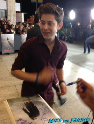 LJ Bennett signing autographs for fans the dark skies movie premiere at the arclight cinerama dome signing autographs