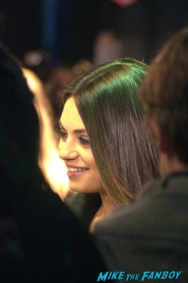 Mila Kunis signed autograph signing autographs for fans at the oz the great and powerful london movie premiere