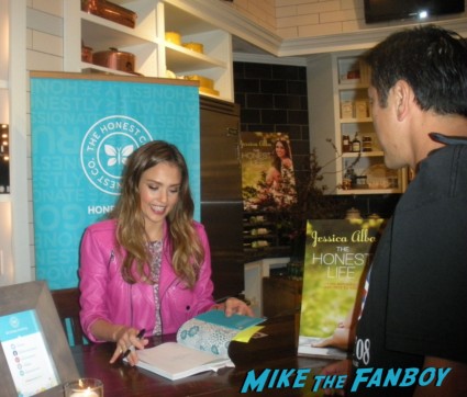 Jessica Alba signing autographs for fans at her book signing for Jessica Alba the honest life book signing in the bay area san francisco