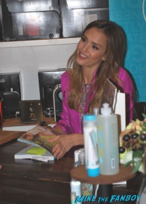 Jessica Alba signing autographs for fans at her book signing for Jessica Alba the honest life book signing in the bay area san francisco