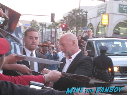 Bruce Willis signing autographs for fans G.I. Joe: Retaliation Movie Premiere Photo Gallery! A Miracle Happened! Bruce Willis Picked Up A Sharpie! Say Wha!?! With Dwayne "The Rock" Johnson! Byung-hun Lee! Luke Bracey! Autographs! Photos! And More! G.I. Joe_March 2013 001