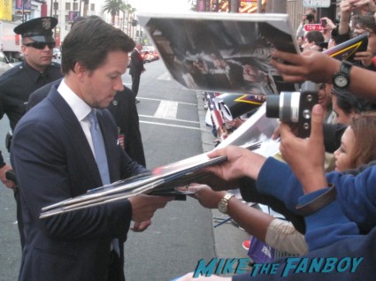 Marky Mark Wahlberg signing autographs at the pain and gain movie premiere with marky mark wahlberg signed autograph rare promo hot