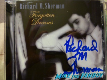 Richard M. Sherman signed cd forgotton dreams signing autographs for fans and playing music at an instore signing
