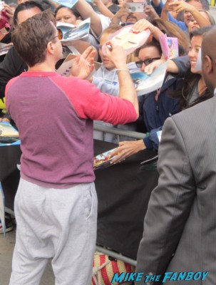 robert downey jr. signing autographs for fans before a talk show taping 