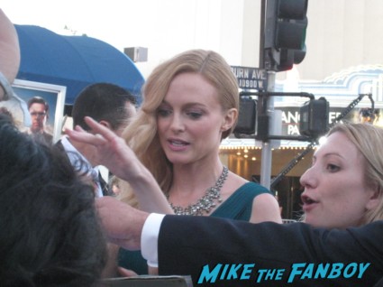 Heather Graham signing autographs at The Hangover Part III red carpet Movie Premiere Photos! Bradley Cooper! Ed Helms! Zach Galifianakis! Justin Bartha! Heather Graham! Jamie Chung! And More!
