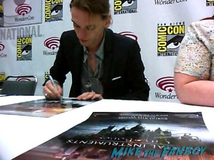 Jamie Campbell-Bower signing autographs at the Mortal Instruments autograph signing Cassandra Clare! Lily Collins! Jamie Campbell-Bower! Kevin Zegers! Autographs! Photos! More!