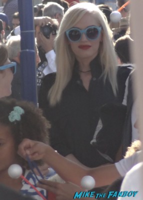 Gwen stefani signing autographs for fans at the Monsters university movie premiere