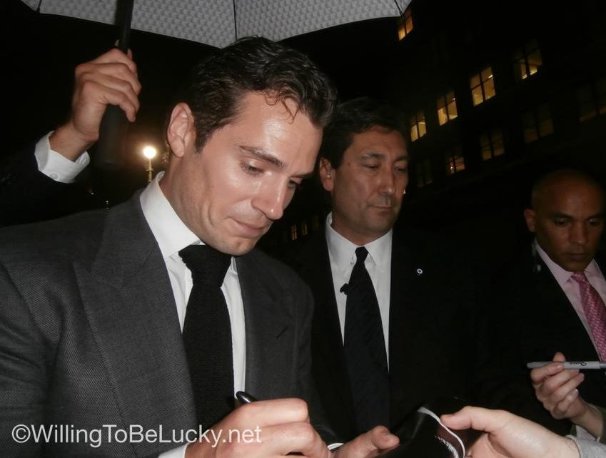 Henry Cavill signing autographs for fans Man Of Steel Movie Premiere