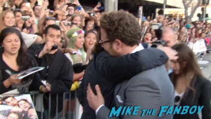 seth rogan signing autographs for fans This Is The End Movie Premiere red carpet