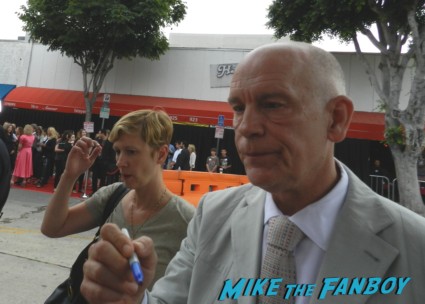 John Malkovich signing autographs for fans at red 2 movie premiere red carpet mary louise parker autograph 009