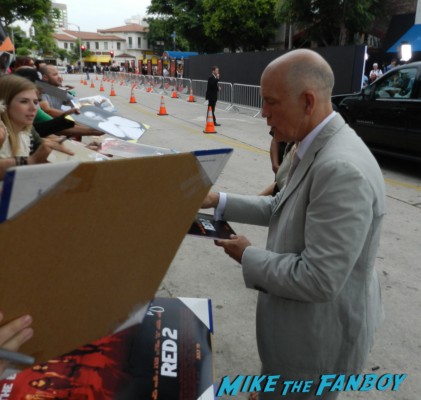 John Malkovich signing autographs for fans at  red 2 movie premiere red carpet mary louise parker autograph 009