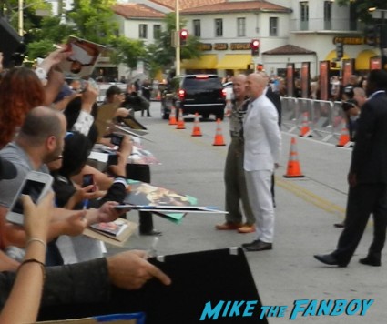 bruce willis arriving to the red 2 movie premiere red carpet mary louise parker autograph 021
