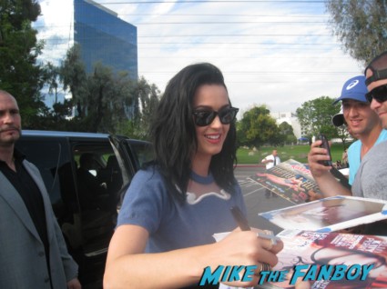 Katy Perry Signing autographs for fans outside the tonight show with jay leno the line of people waiting to meet katy perry sign autographs