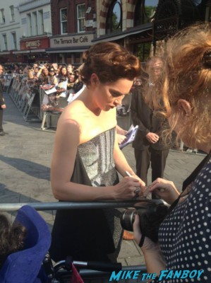 Ruth Wilson signing autographs for fans at the uk premiere of The Lone Ranger