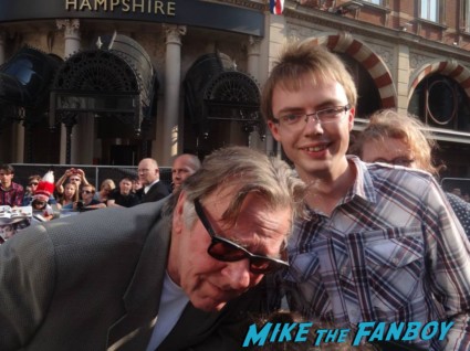 Tom Wilkinson signing autographs for fans at the uk premiere of The Lone Ranger