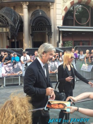 Gore Verbinski signing autographs for fans at the uk premiere of The Lone Ranger