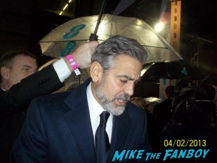 George Clooney signing autographs for fans