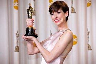 Anne Hathaway holds her Oscar for winning Best Supporting Actress for her role in "Les Miserables" in Hollywood