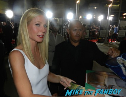 Gwyneth Paltrow signing autographs for fans Thanks for sharing movie premiere Gwyneth Paltrow red carpet pink tim robbins