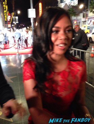 Regina Hall signing autographs rare Morris Chestnut Sanaa Lathan Terrence Howard signing autographs for fans iron man The best man holiday movie premiere marquee