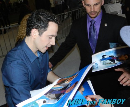 Santino Fontana signing autographs frozen movie premiere los angeles red carpet 031