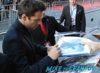 Sebastian Stan signing autographs Captain America: The Winter Soldier premiere red carpet25