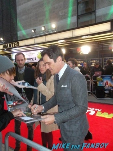 Ty Burrell signing autographs Muppets Most Wanted UK Premiere red carpet ricky gervais2