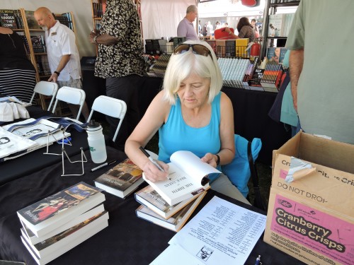 Patricia Wynn signing her book "The Birth of Blue Satan"