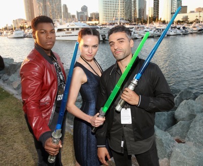 SAN DIEGO, CA - JULY 10: (L-R) Actors John Boyega, Daisy Ridley, Oscar Isaac and more than 6000 fans enjoyed a surprise `Star Wars` Fan Concert performed by the San Diego Symphony,  featuring the classic `Star Wars` music of composer John Williams, at the Embarcadero Marina Park South on July 10, 2015 in San Diego, California.  (Photo by Jesse Grant/Getty Images for Disney) *** Local Caption *** Oscar Isaac; John Boyega; Daisy Ridley
