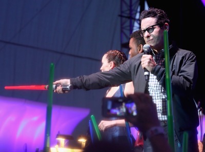 SAN DIEGO, CA - JULY 10: (L-R) Actors Daisy Ridley, John Boyega, director J.J. Abrams and more than 6000 fans enjoyed a surprise `Star Wars` Fan Concert performed by the San Diego Symphony, featuring the classic `Star Wars` music of composer John Williams, at the Embarcadero Marina Park South on July 10, 2015 in San Diego, California.  (Photo by Jesse Grant/Getty Images for Disney) *** Local Caption *** Daisy Ridley; John Boyega; J.J. Abrams